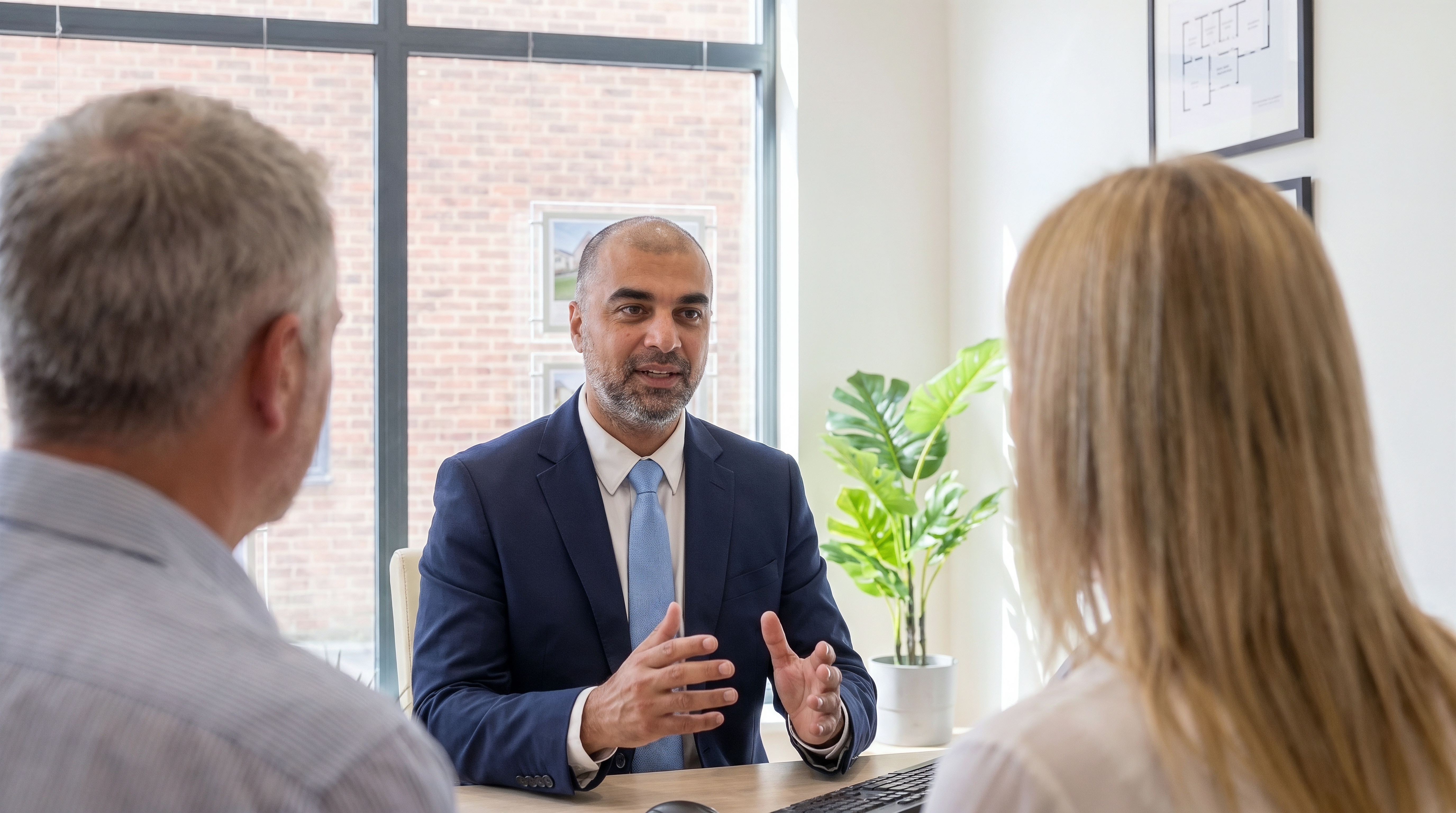 Sunny Gill speaking with clients